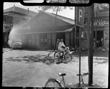 Quinn's Tahitian Hut store, Tahiti, bicycles can be seen leaning on posts