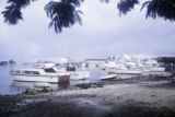 French Polynesia, fishing boats docked along shore of Tahiti Island