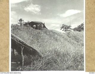 DUMPU, NEW GUINEA. 1944-01-11. THE W/T TRANSMITTING STATIONS OF THE 109TH TRANSMITTING STATION, 7TH DIVISION SIGNALS DUG INTO A HILLSIDE