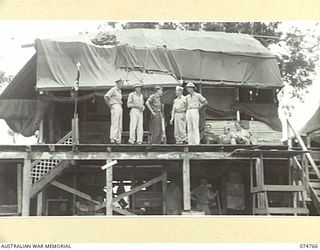 MADANG, NEW GUINEA. 1944. PERSONNEL OF THE 593RD UNITED STATES BARGE COMPANY ON THE BALCONY OF THE UNIT HEADQUARTERS