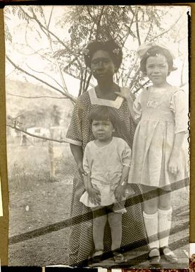 [Joan and Neville Stanley with unidentified female domestic worker, Port Moresby, New Guinea, ca. 1920]