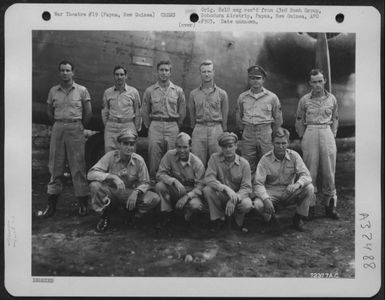 Crew members of the 43rd Bomb Group pose by a Consolidated B-24 "Liberator" at their base on Dobodura Airstrip, Papua, New Guinea. (U.S. Air Force Number 72377AC)