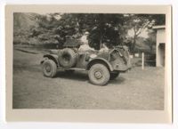 Army Nurse and two male service members in army vehicle, Fiji