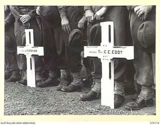 DUMPU, NEW GUINEA. 1944-02-06. GRAVES OF VX54840 LIEUTENANT J.H. GRAHAM AND WX15415 TROOPER C.E. EDDY IN DUMPU WAR CEMETERY. MEMBERS OF MANY UNITS TRAVELLED CONSIDERABLE DISTANCES TO ATTEND THE ..