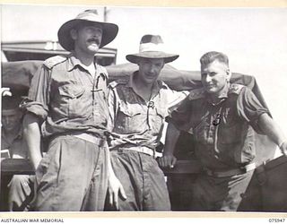 HANSA BAY, NEW GUINEA. 1944-09-08. VX74779 CAPTAIN C.C. GUY, HEADQUARTERS, 5TH DIVISION (1) CONDUCTING CAPTAIN R.L. ARCHIBALD (2) AND CAPTAIN R.M. BALDWIN (3) TWO CANADIAN ARMY OFFICERS ON A TOUR ..
