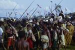 Dancers, 10 years earlier all dancers have worn tribal ceremonial dress, now there is a motley mixture of dress, Maprik, [Papua New Guinea, 1963?]