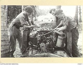 NEW GUINEA. 27 FEBRUARY 1944. AUSTRALIANS ON HUON PENINSULA OVERHAULING ENGINE OF MATILDA TANK