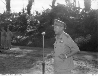 BOUGAINVILLE. 1945-04-27. MAJOR GENERAL C.H. SIMPSON, SIGNAL OFFICER IN CHIEF (3), INSPECTING CHOREHORSE CHARGERS AT 3 DIVISION SIGNALS (AIF), DURING HIS VISIT TO SOUTH BOUGAINVILLE TO INSPECT ..