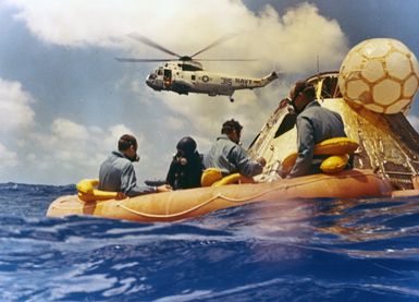 Photograph of Apollo 12 Astronauts Awaiting Pickup by Rescue Helicopter