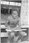 Man carving on a piece of wood