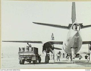 PAPUA. 1942-07-27. RE-FUELLING AND SERVICING AN AMERICAN B26 MARAUDER BOMBER OF US AIR FORCE 22ND BOMB GROUP, PROBABLY AT THE AIRFIELD AT SEVEN MILE STRIP, IMMEDIATELY AFTER ITS RETURN FROM A RAID ..