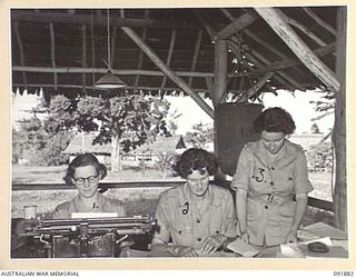 LAE, NEW GUINEA, 1945-05-16. PRIVATE E.G. COLLINS (1), PRIVATE L. WHITE (2) AND PRIVATE M. WESTAWAY (3), AUSTRALIAN WOMEN'S ARMY SERVICE PERSONNEL WORKING WITH THE ASSISTANT DIRECTOR OF ORDNANCE ..