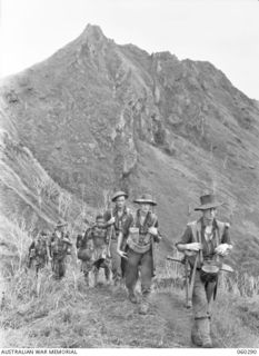 RAMU VALLEY AREA, NEW GUINEA. 1943-11-08. TROOPS OF THE 2/27TH AUSTRALIAN INFANTRY BATTALION MOVING ALONG THE TRACK FROM GUY'S POST. SHOWN ARE : SX5980 PRIVATE L. W. WHITTKE (1); SX12120 PRIVATE L. ..