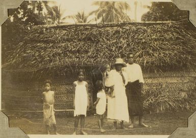 Group in front of traditional Tongan house, 1928