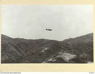 Japanese unsuccessfully attack Wau. A C-47 Dakota transport aircraft near Wau aerodrome