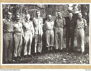 DUMPU, NEW GUINEA. 1943-12-01. SENIOR OFFICERS OF THE 7TH AUSTRALIAN DIVISION. THEY ARE: WX3396 MAJOR P. S. SMITH, DEPUTY ADJUTANT AND QUARTERMASTER GENERAL (1); W1565 MAJOR H. A. SOLOMON, DEPUTY ..