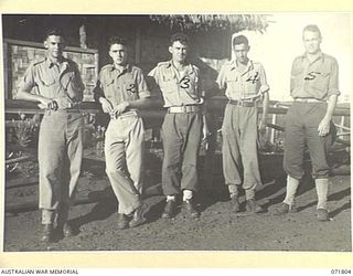 ILOLO, NEW GUINEA, 1944-03-30. CAMP PERSONNEL AT THE AUSTRALIAN NEW GUINEA ADMINISTRATIVE UNIT (ANGAU). LEFT TO RIGHT: N37564 CORPORAL W. J. WATERS; NX81246 PRIVATE L. N. OWENS; PX181 WARRANT ..