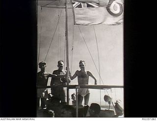 Astrolabe Bay, Madang, New Guinea, 1945-10-01. A group of officers from Headquarters, RAAF Northern Command (NORCOM), aboard RAAF Crash Launch no. 08-40 of No. 111 Air Sea Rescue Flight. The man ..