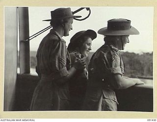 LAE, NEW GUINEA, 1945-05-07. AWAS PERSONNEL LOOKING ACROSS THE WATER TO THE SHORE FROM THE MV DUNTROON BEFORE DISEMBARKATION. THEY ARE PART OF A GROUP OF 342 AWAS FROM AUSTRALIA EN ROUTE TO THE ..