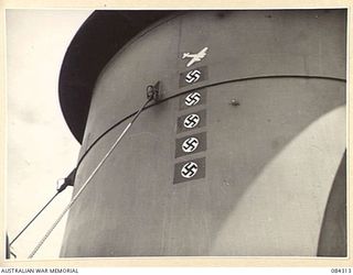 CUTARP PLANTATION, JACQUINOT BAY, NEW BRITAIN. 1944-12-15. MARKINGS ON A FUNNEL OF THE TROOPSHIP FRANCIS PARKMAN INDICATING FIVE GERMAN AIRCRAFT DESTROYED BY THE SHIP'S GUNNERS AT SALERNO DURING ..