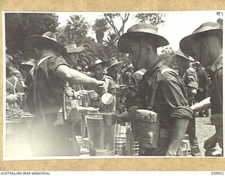 MELBOURNE, VIC. 1943-11-18. AFTER A LONG PERIOD OF FIGHTING IN NEW GUINEA, THE 17TH AUSTRALIAN INFANTRY BRIGADE WAS GIVEN LEAVE. AT THE CONCLUSION OF THE LEAVE, THE UNIT STAGED A MARCH THROUGH THE ..