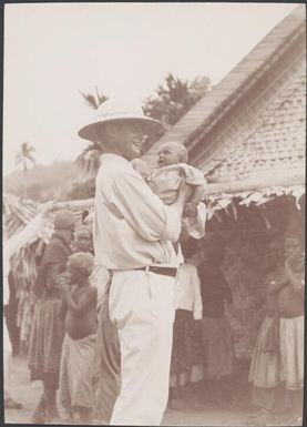 Bishop Wilson holding Hugo Hebala's baby at Buala, Solomon Islands, 1906 / J.W. Beattie