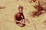 Man sitting on ground, 1962