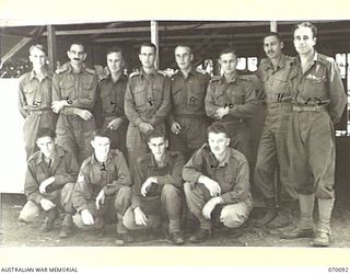 DUMPU, NEW GUINEA. 1944-01-25. GROUP OF GENERAL STAFF, INCLUDING CLERKS AT HEADQUARTERS 7TH DIVISION. IDENTIFIED PERSONNEL ARE: QX51773 PRIVATE H.C. CLOHERTY (1); NX102029 LANCE SERGEANT M.R. MOORE ..