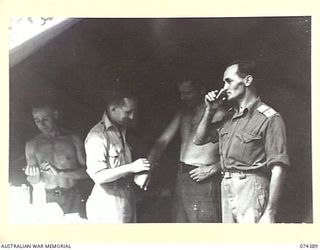 SIAR, NEW GUINEA. 1944-06-28. MEN RECEIVING TREATMENT AT THE REGIMENTAL AID POST OF HEADQUARTERS, 15TH INFANTRY BRIGADE. IDENTIFIED PERSONNEL ARE:- VX89731 CORPORAL S.R. CHENERY (1); VX147592 ..