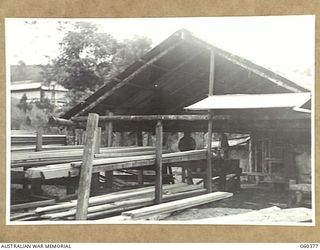 SOGERI, NEW GUINEA. 1943-11-20. STAFF PERSONNEL OF THE SCHOOL OF SIGNALS, NEW GUINEA FORCE, WORKING AT THE UNIT SAWMILL. ALL TIMBER USED IN THE CONSTRUCTION OF THE BARRACKS AND OTHER BUILDINGS IS ..