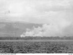 OFF TULAGI, 1942-08-07. A VIEW OF TULAGI AFTER HEAVY OFF SHORE BOMBARDMENT