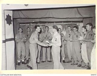 LAE AREA, NEW GUINEA. 1945-08-11. A DANCE AND STAGE PRESENTATION WAS HELD AT THE LAE BASE SUB-AREA SERGEANTS' MESS. SHOWN, THE FINALE WITH FULL CAST