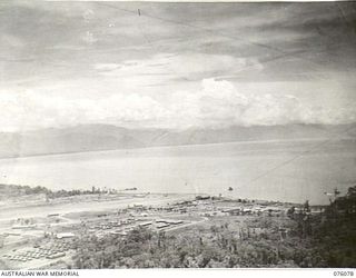 LAE, NEW GUINEA. 1944-09-19. AN AERIAL VIEW SHOWING THE WHARVES AND HARBOUR