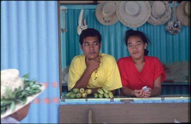 Two children behind counter