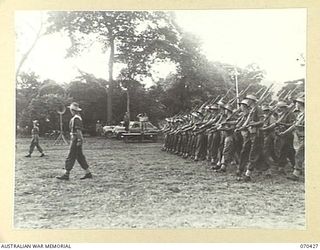 POM POM VALLEY, NEW GUINEA, 1944-02-16. NX8 LIEUTENANT-GENERAL SIR LESLIE MORSHEAD, KCB., KBE., CMG., DSO., ED., GENERAL-OFFICER-COMMANDING NEW GUINEA FORCE, TAKES THE SALUTE AS OFFICERS AND MEN OF ..