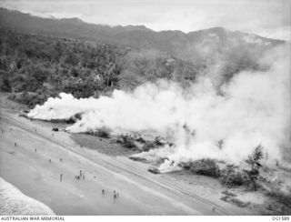 WEWAK AREA, NORTH EAST NEW GUINEA. C. 1945-03. SMOKE BILLOWS FROM TARGETS SET ON FIRE BY BEAUFORT BOMBER AIRCRAFT OF NO 8 SQUADRON RAAF AND NO. 100 SQUADRON RAAF. JAPANESE "SMOKED OUT" BY THE ..