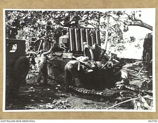 PERSONNEL OF THE 1ST TANK BATTALION GROUP WORKSHOPS, AUSTRALIAN ELECTRICAL AND MECHANICAL ENGINEERS OVERHAULING A MATILDA TANK