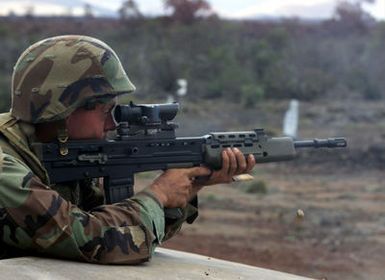 US Marine Corps Lance Corporal Jamison from the 1ST Battalion, 3rd Marines, Weapons Company, fires a British Royal Marines' SA-80 rifle during a training exercise at Pohakuloa Training Area on the Big Island of Hawai