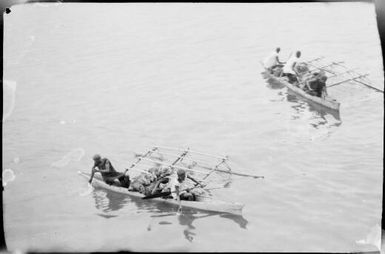 Looking down on two laden outrigger canoes, New Guinea, ca. 1929 / Sarah Chinnery