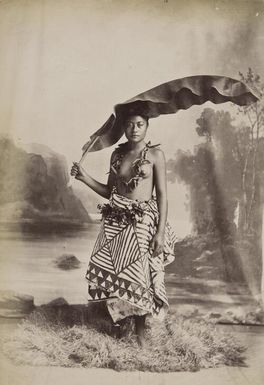 Unidentified young woman with banana frond