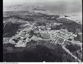 GUAM. AERIAL VIEW OF THE HEADQUARTERS OF THE COMMANDER IN CHIEF OF THE UNITED STATES' PACIFIC FLEET (CINCPAC), ADMIRAL CHESTER W. NIMITZ. NIMITZ'S RESIDENCE WAS IN THE HOUSE INSIDE THE LOOP ROAD AT ..