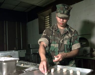 LCPL Joe Federico from the 2d Battalion, 8th Marines, out of Camp Lejeune, N.C., makes cookies for the evening meal at Marine Expeditionary Camp-Pohang (MEC-P), Oct. 11, 1998. Federico, originally from Honolulu, Hawaii, is a baker deployed to MEC-P in support of Foal Eagle '98