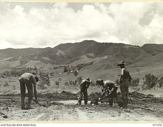 RAMU VALLEY, NEW GUINEA. 1944-03-15. TROOPS FROM NO. 2 PLATOON, 2/4TH FIELD COMPANY, HARD AT WORK ON THE ROAD FROM EVAPIA RIVER TO KESAWAI