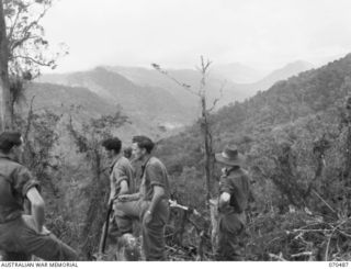 CRATER HILL, FINISTERRE RANGE, NEW GUINEA, 1944-02-16. THE VIEW NORTH NORTH WEST FROM CRATER HILL ALONG THE MINDJIM RIVER VALLEY. IN THIS VALLEY LIES PAPIPA 1 AND 2 AND SAIPA 1 AND 2. THE TROOPS IN ..