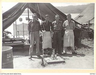 WEWAK POINT, NEW GUINEA. 1945-10-02. A SMARTNESS OF LINES COMPETITION WAS HELD AT 2/3 MACHINE-GUN BATTALION AND TROOPS WERE GIVEN A WEEK TO DECORATE THEIR LINES. THE COMPETITION WAS WON BY A 10 ..