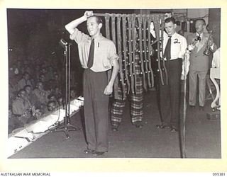 TOROKINA, BOUGAINVILLE, 1945-08-16. BELL RINGERS PERFORMING AT THE GRACIE FIELDS CONCERT FOR TROOPS OF HEADQUARTERS 2 CORPS