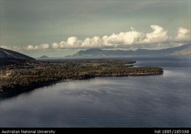 West Fergusson, views of Kalokalo from the air, showing coastal mountain and beach