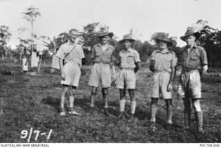 LUMI, NEW GUINEA, 1943-07-09. GROUP PORTRAIT OF SOME MEMBERS OF M SPECIAL UNIT, SERVICES RECONNAISSANCE DEPARTMENT, ALLIED INTELLIGENCE BUREAU, AT LUMI, ABOUT 50 KILOMETRES SOUTH OF AITAPE. SHORTLY ..