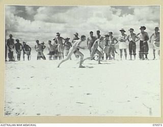 KELANOA, NEW GUINEA, 1944-02-20. THE FIRST HEAT OF THE 50 YARD DASH AT THE MOST FORWARD BEACH CARNIVAL IN NEW GUINEA, ORGANISED BY THE AUSTRALIAN ARMY AMENITIES SERVICE, 5TH DIVISION. THE EVENT WAS ..