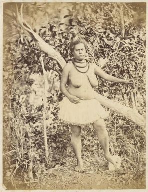 Kanak woman standing with pipe in mouth, New Caledonia, ca. 1870s / Allan Hughan